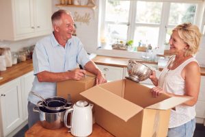 Golden Years Resources 7 senior couple downsizing in retirement packing